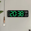 A digital wall clock displaying 20:38, 58% humidity, and 23 degrees Celsius on a light gray wall.