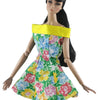A handmade doll dress gown featuring a floral print and a yellow sash on a black-haired doll.