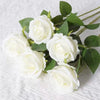 A bouquet of white artificial roses with green leaves.