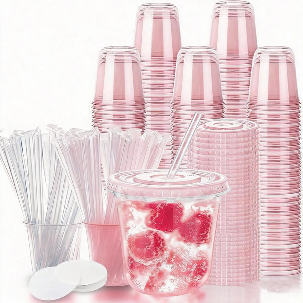 A collection of pink disposable party cups with a U-shaped design and straws are displayed on a white surface.
