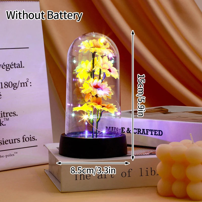 An eternal rose LED decorative flower in a glass dome displayed on a dark base.