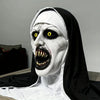 A realistic horror nun latex mask with pale white skin, black veil, and exaggerated facial features.