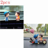 A set of two cute couple balloon car ornaments featuring a boy and a girl.