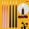 A set of four black taper candles with dripping red blood effect for Halloween