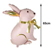 Pink foil balloon shaped like a bunny with gold accents, measuring 65cm tall.
