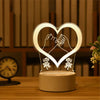 A heart-shaped acrylic night light featuring a handprint design, illuminated with white LED light.