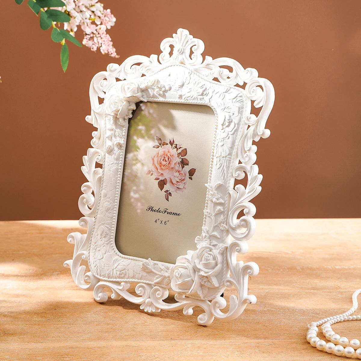 White European-style resin photo frame with ornate detail displaying a pink rose design.