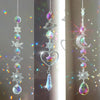 A silver crystal wind chime pendant featuring iridescent stones, a star, and a crescent moon.