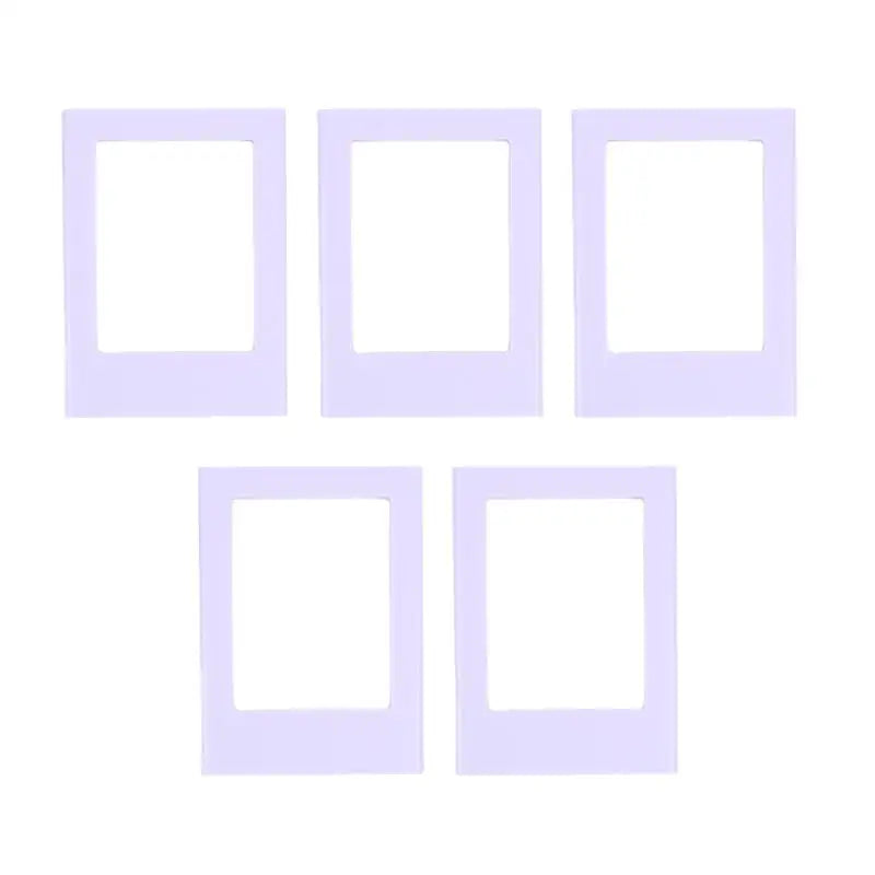 A set of five white decorative photo frame magnets.