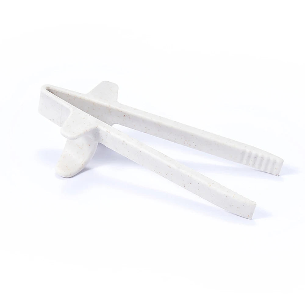 A pair of white reusable wheat straw finger chopsticks shown against a white background.