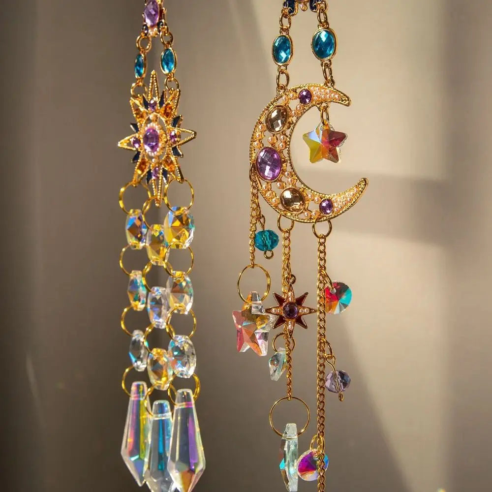 A delicate gold crystal suncatcher wind chime ornament featuring purple and blue gemstone charms.