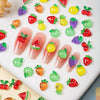 Colección de 50 mini charms de uñas con tortugas coloridas, presentando frutas como fresas, manzanas y cítricos en varios ton
