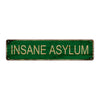 A rectangular, weathered green metal tin sign with the text INSANE ASYLUM.