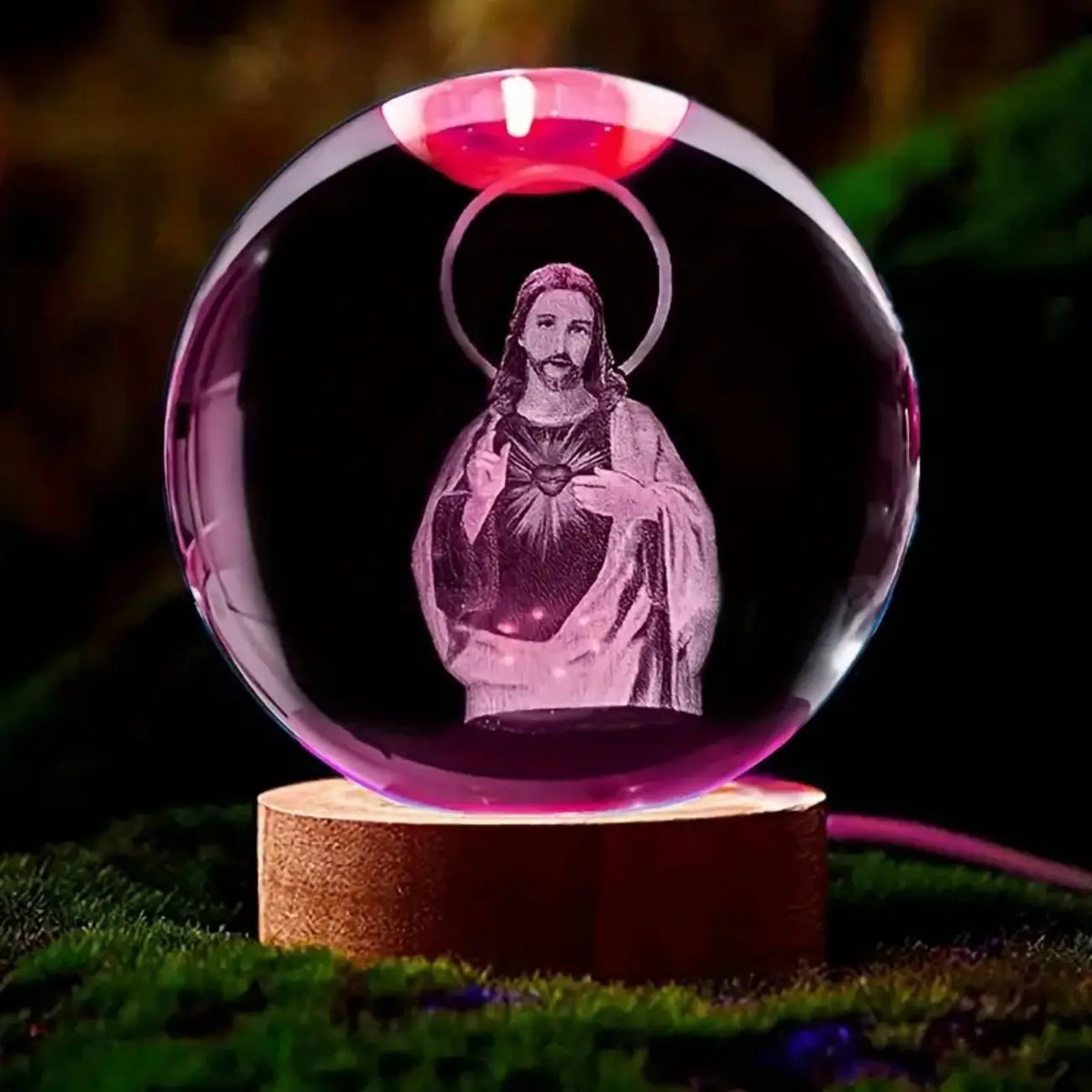 A clear crystal ball night light featuring a glowing depiction of Jesus Christ on a dark background.