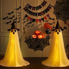 A yellow ghost decoration with a pointed hat and LED string lights is displayed against a spooky Halloween backdrop.
