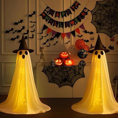 A yellow ghost decoration with a pointed hat and LED string lights is displayed against a spooky Halloween backdrop.