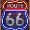 A rustic metal wall sign featuring the number 66 outlined in neon lights on a dark brick background.