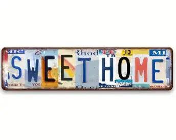 Vintage retro metal street sign with the words SWEETHOME in distressed lettering.