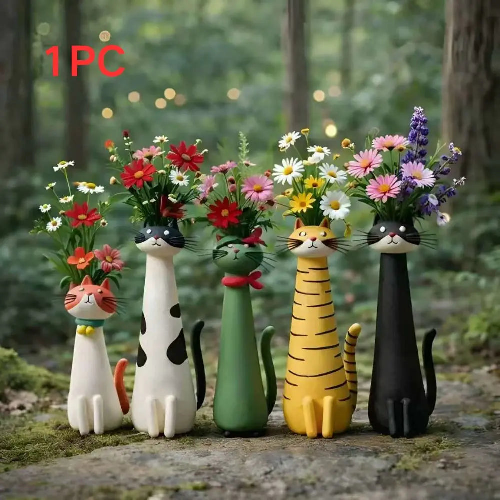 One piece of cat-shaped resin vases holding colorful flowers in a natural outdoor setting.