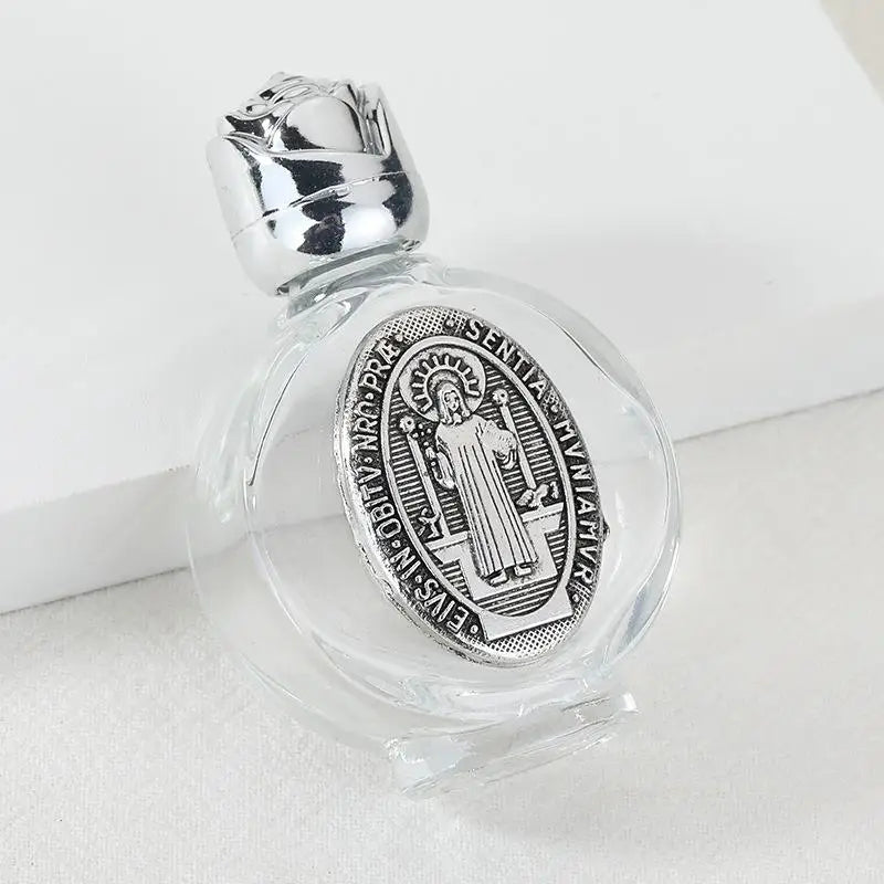 Decorative glass bottle with a silver figurine and twist cap
