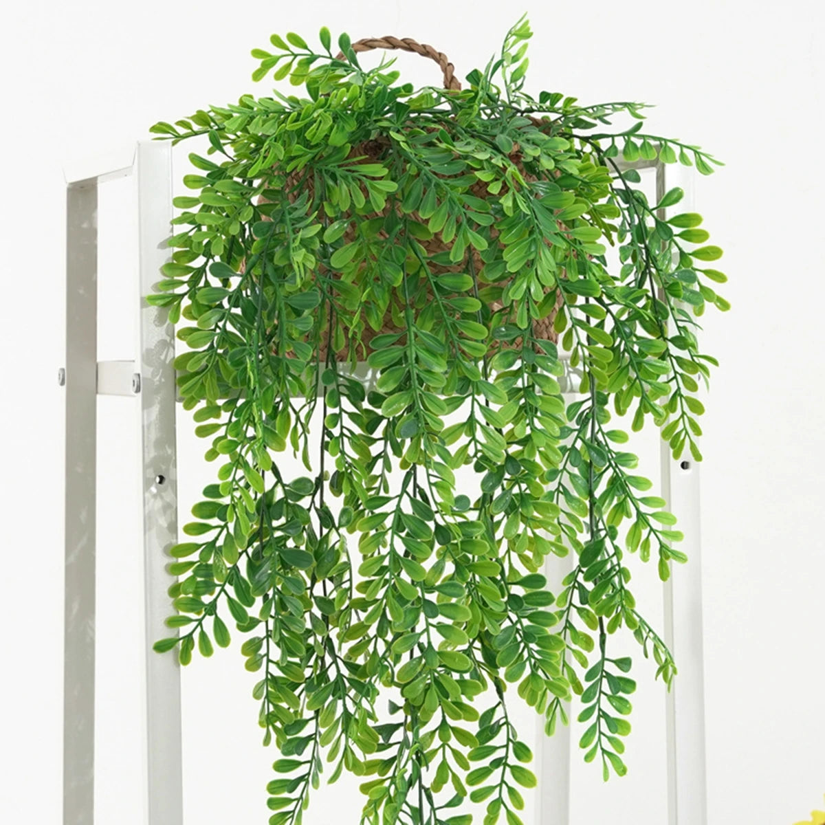 Artificial ivy garland with a pot hanging from a wooden hanger for home and event decor