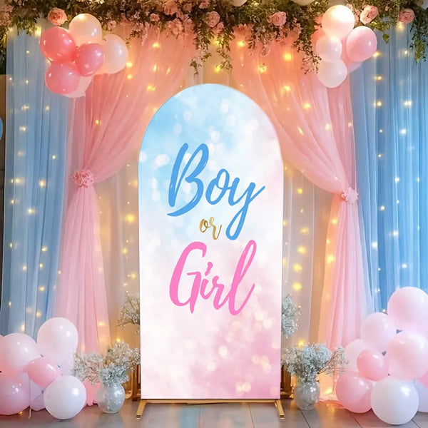 A pink and blue draped arch backdrop for a baby shower or gender reveal party featuring balloons and floral accents.