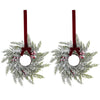A 10-inch artificial Christmas wreath decorated with green foliage, red berries, and a deep red velvet bow.