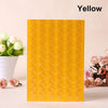 A yellow PVC photo corner protector with a honeycomb pattern displayed next to white flowers.