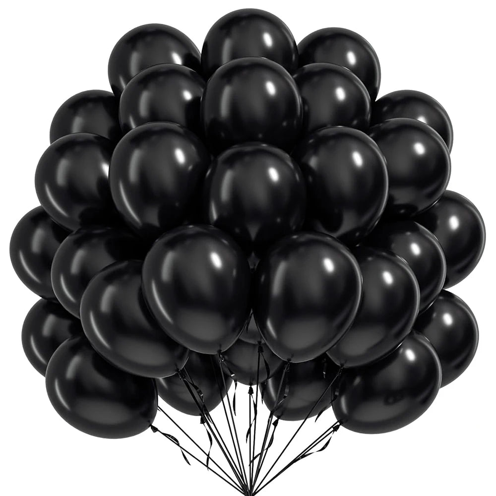 A bunch of black round latex balloons tied together for a celebration