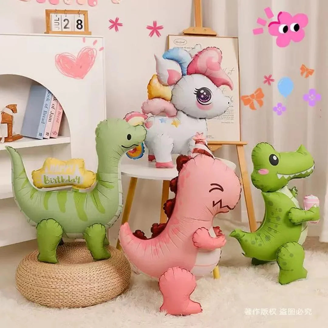 A collection of pink and green dinosaur-shaped balloons and decorations for a party.