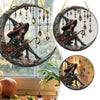 Two circular stained glass window decorations featuring a witch figure in a hat and cloak.