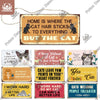 A collection of wooden wall plaques with humorous cat-themed sayings and illustrations.