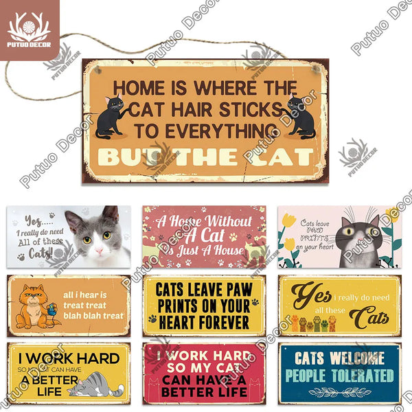 A collection of wooden wall plaques with humorous cat-themed sayings and illustrations.