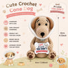 A handmade crochet cone dog doll with an inspirational card, featuring soft brown fur and a white mesh collar.
