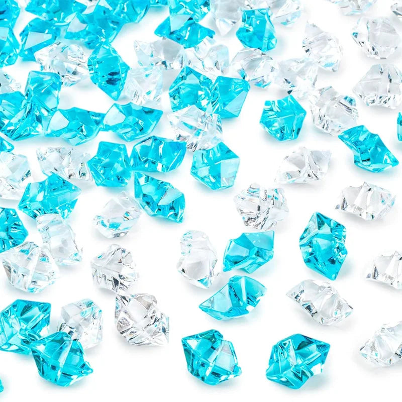 A pile of decorative crushed diamond acrylic pebbles in various shades of blue and clear.