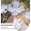 A set of three large, sheer white mesh flowers used as wedding or floral decoration.