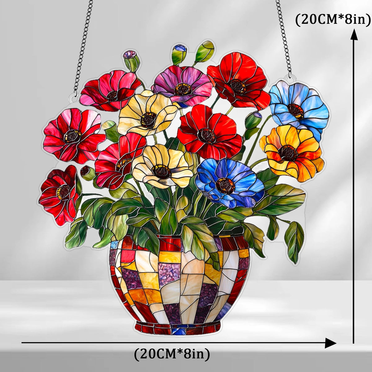 A hanging ornament featuring colorful acrylic flowers in a glass pot, designed as a sun catcher.
