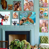 A custom photo canvas print featuring a family portrait displayed on a light blue wall.