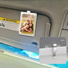 Clear acrylic photo clip with a warning sign featuring a family portrait mounted on a car sun visor.