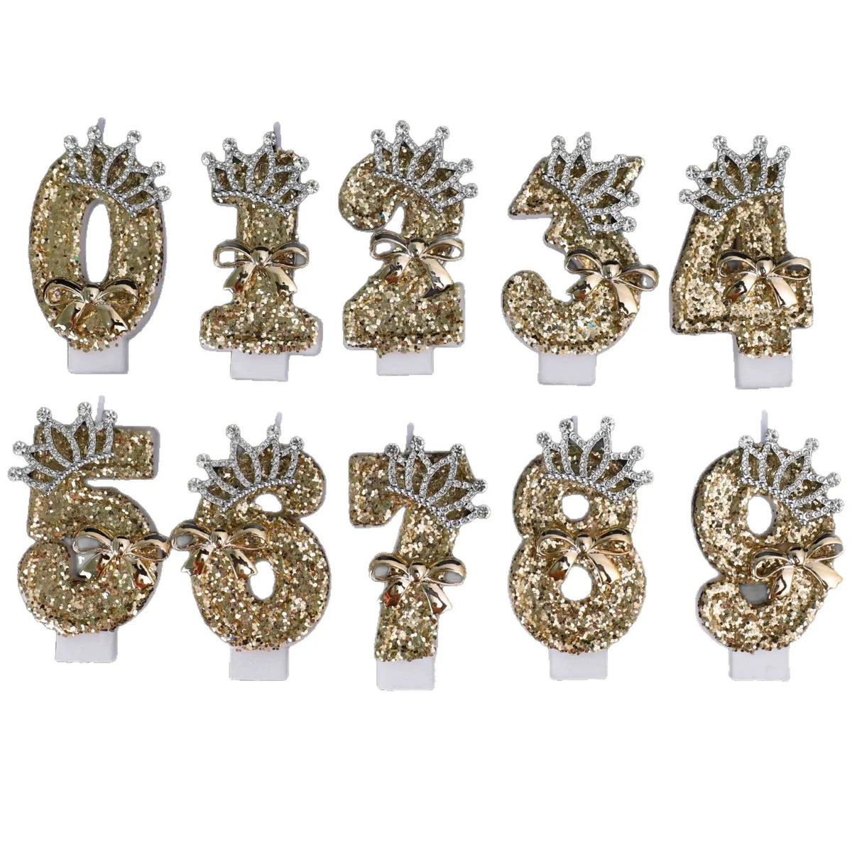 A set of gold glitter number cake toppers featuring rhinestones and bow designs.