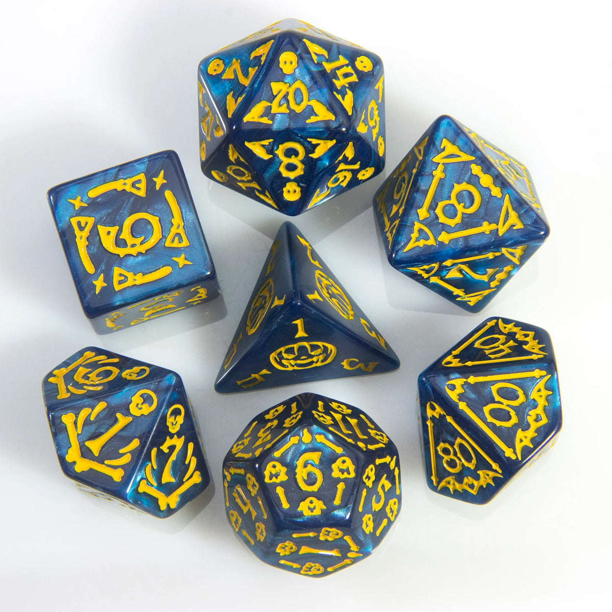 A set of seven polyhedral dice in blue and yellow colors arranged on a white surface.