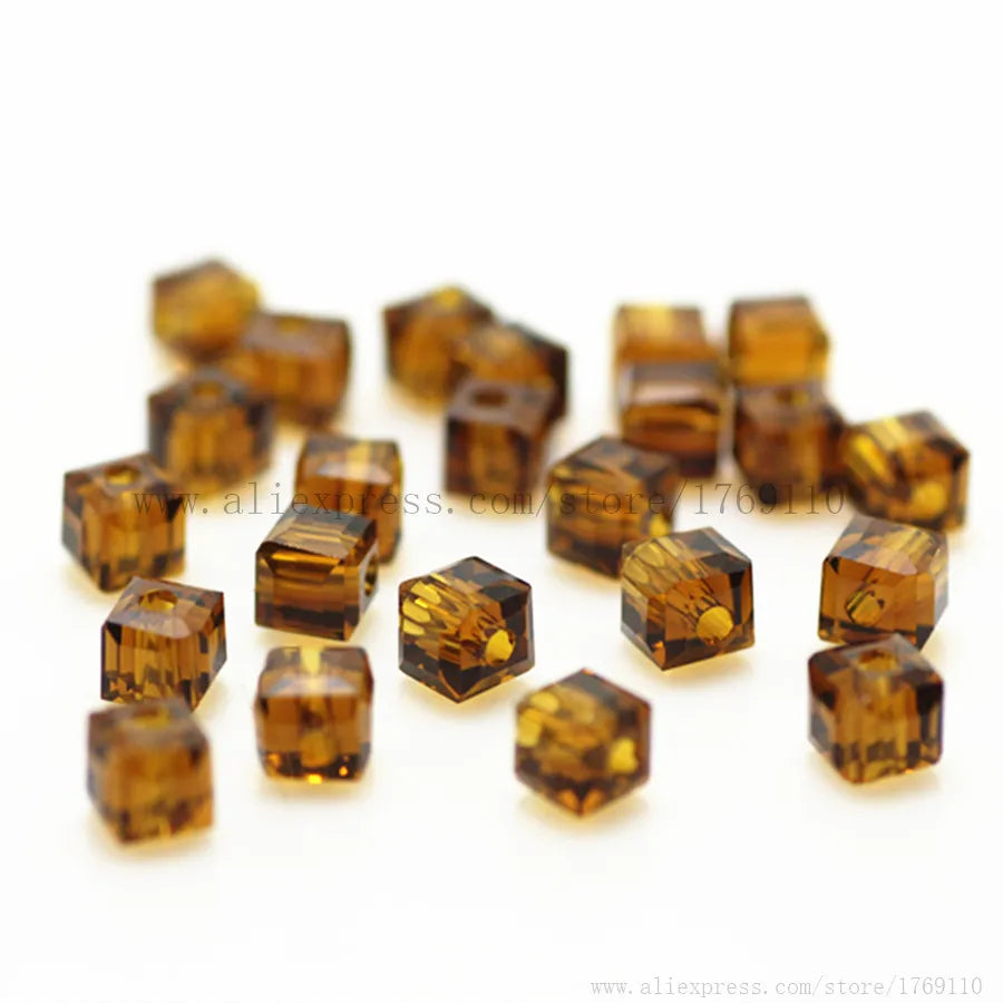 A collection of square cut amber glass crystal beads for jewelry making