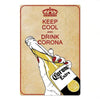A vintage metal sign featuring text instructing to keep cool and drink Corona Extra.