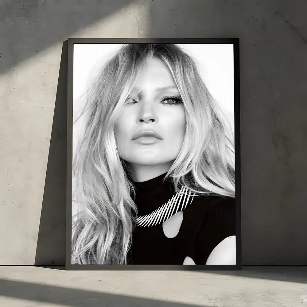 Black and white portrait of a woman with long blonde hair wearing a black turtleneck and a silver necklace