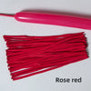 A bundle of rose red latex strip balloons and a pink balloon stick.