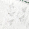 White lace fabric featuring several delicate embroidered butterfly patches for crafts and decor