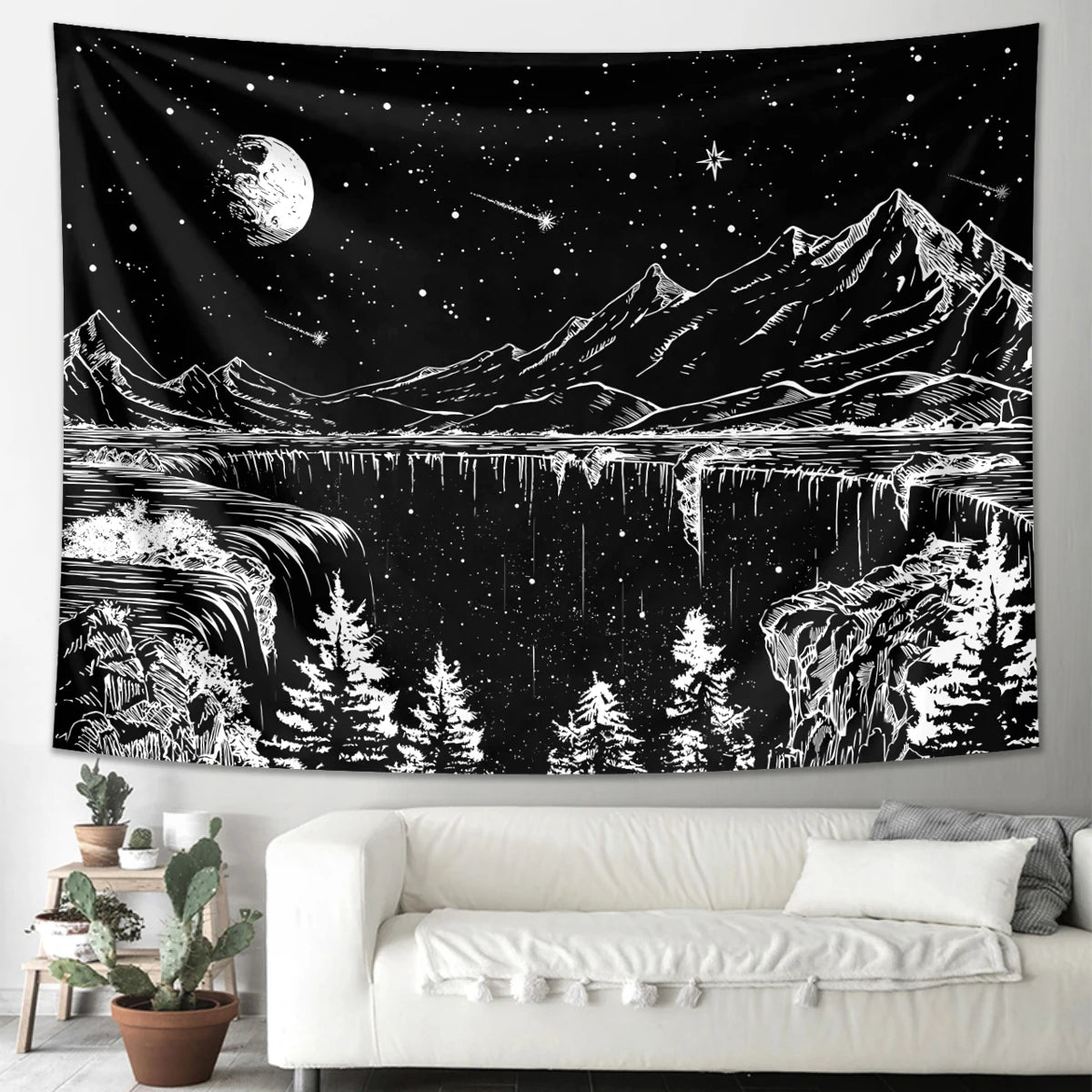 A black tapestry depicting a starry night landscape with mountains, water, and trees in white and gray.