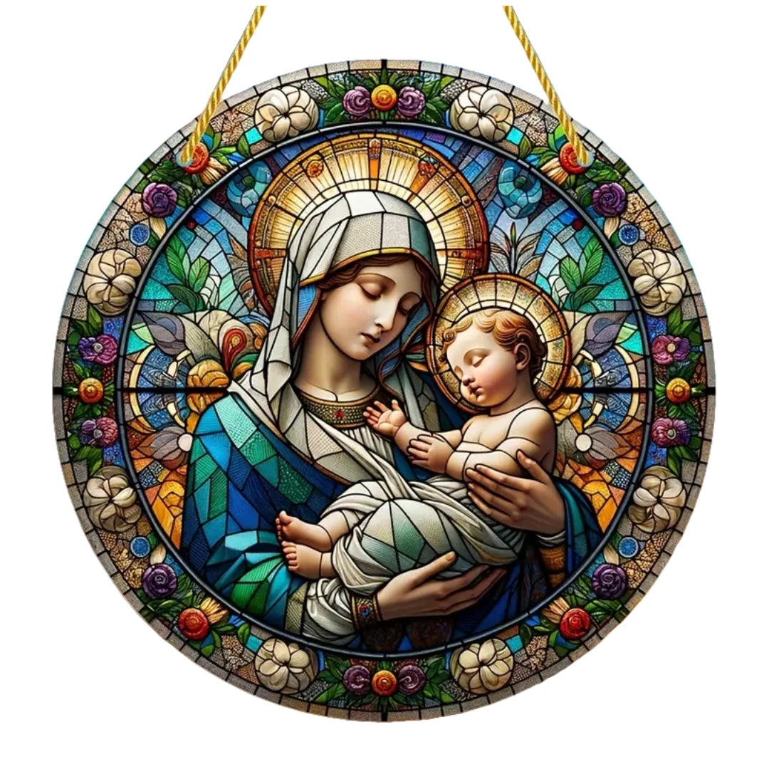 A stained glass style acrylic suncatcher depicting the Virgin Mary holding the infant Jesus.