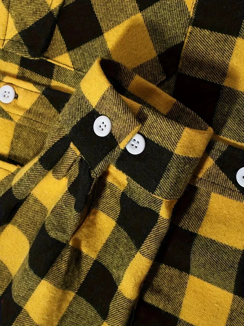 A close-up of a men's brushed flannel shirt with a yellow and black plaid pattern.