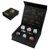 A black gift box containing natural stone zodiac bracelets for Cancer, Leo, and Aries signs.
